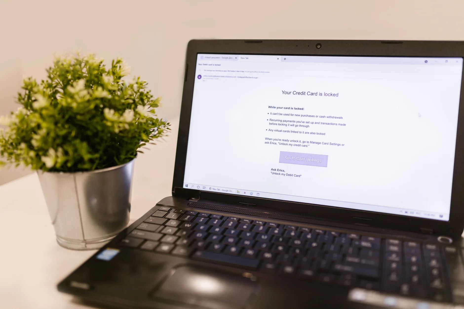 laptop screen showing a fake credit card security notification